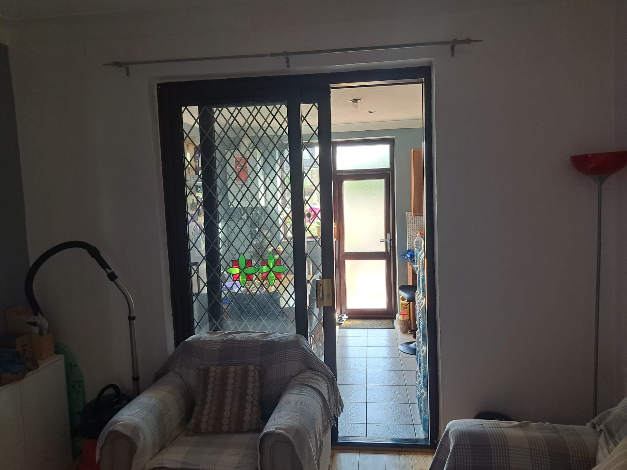 door, indoors, interior design, furniture, living room, housing, sliding door, french window, house, couch
