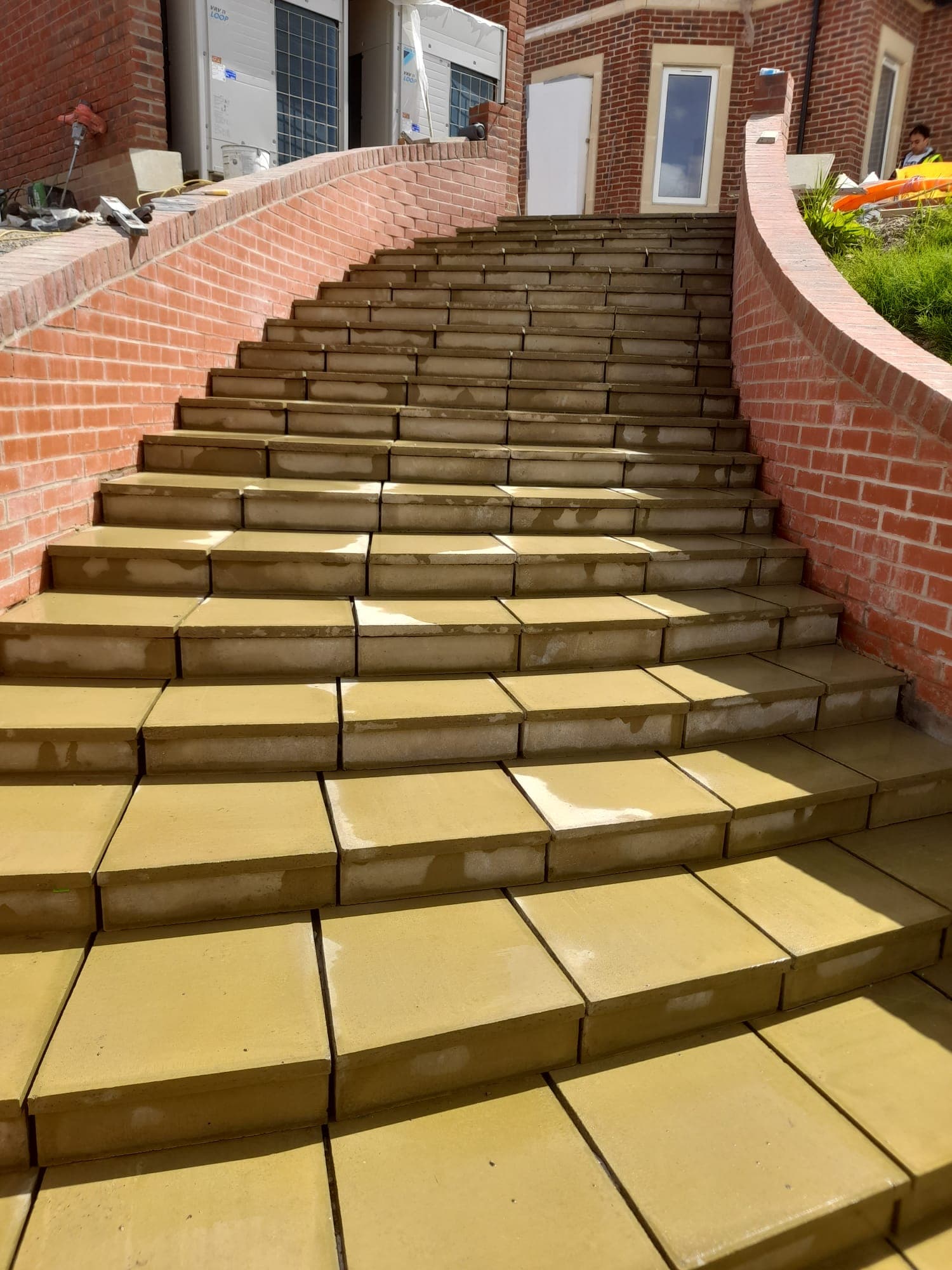 path, walkway, floor, building, house, housing, staircase, brick, flagstone, person
